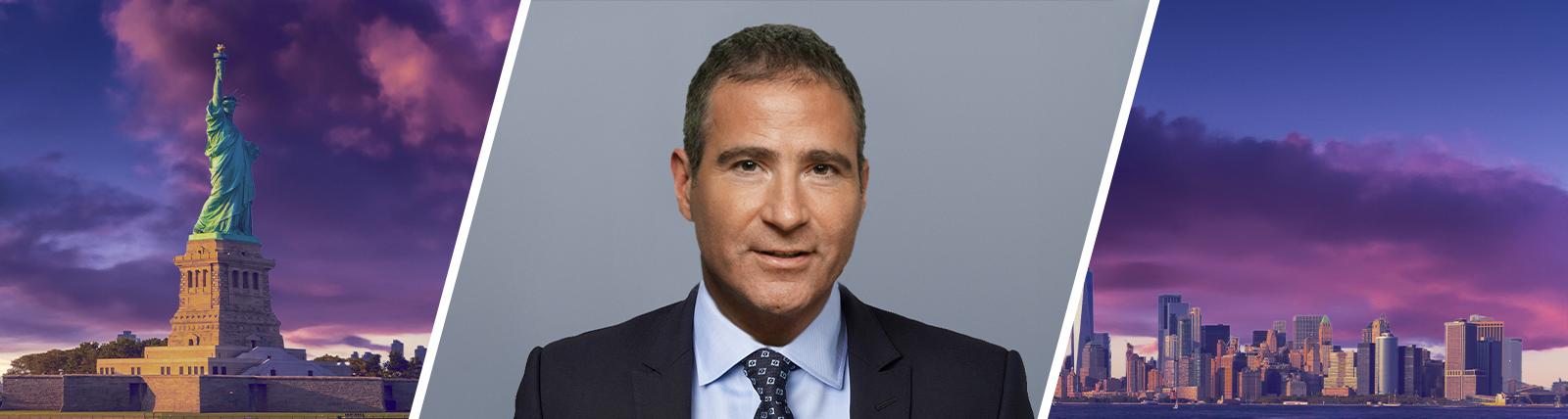 Portrait of David L. Finkelstein in front of a New York City skyline.