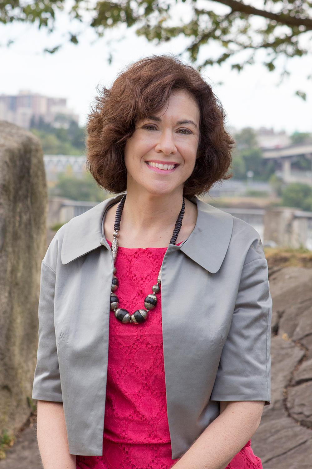 A headshot of Sarah Brandt smiling.